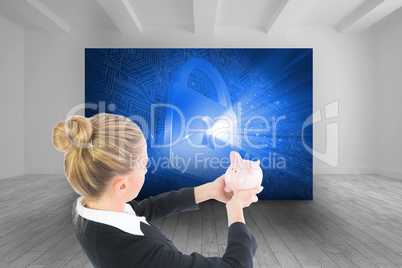 Composite image of businesswoman holding piggy bank