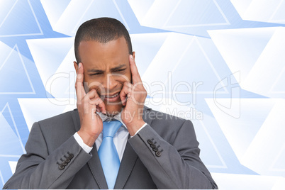 Composite image of stressed businessman putting his fingers on h