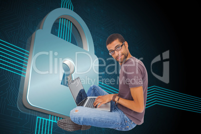 Composite image of man wearing glasses sitting on floor using la