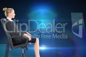 Composite image of businesswoman sitting on swivel chair in blac