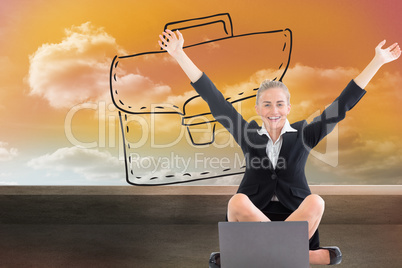 Composite image of businesswoman sitting in front of laptop with