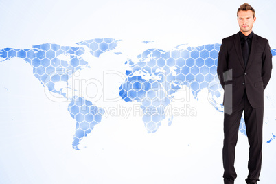 Composite image of young businessman looking at the camera