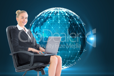 Composite image of businesswoman sitting in swivel chair with la