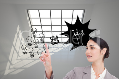 Composite image of young saleswoman operating touchscreen