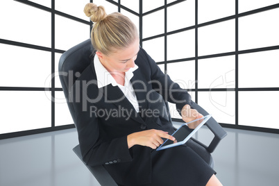 Composite image of businesswoman sitting on swivel chair with ta