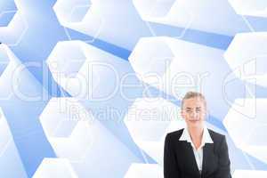 Composite image of businesswoman using laptop