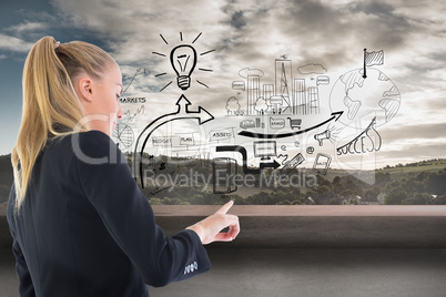 Composite image of businesswoman pointing somewhere