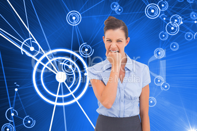 Composite image of furious businesswoman looking at the camera