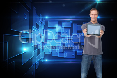 Composite image of young man showing screen of his tablet comput