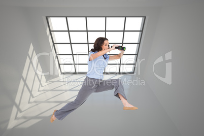 Composite image of cheerful classy businesswoman jumping while h