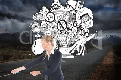 Composite image of businesswoman pulling a rope