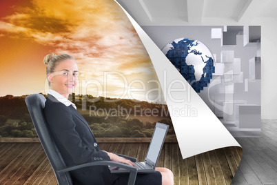 Composite image of businesswoman sitting on swivel chair with la