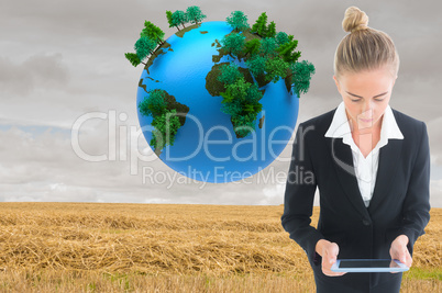 Composite image of businesswoman holding new tablet