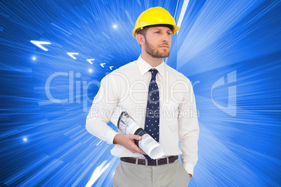 Composite image of young architect posing with hard hat and plan