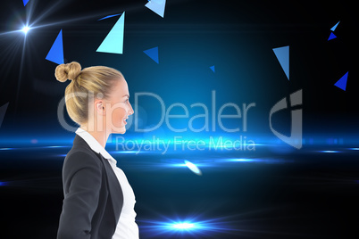 Composite image of businesswoman standing with hands on hips