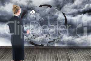 Composite image of businesswoman holding new tablet