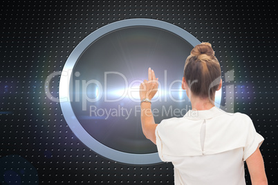 Composite image of businesswoman touching something