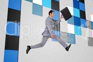 Composite image of businessman running with a suitcase