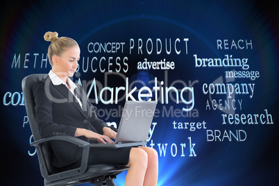 Composite image of businesswoman sitting on swivel chair with la