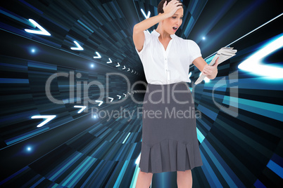 Composite image of surprised classy businesswoman holding newspa