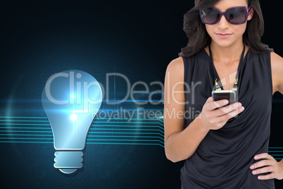 Composite image of happy brunette using smartphone