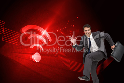 Composite image of happy businessman in a hury