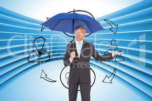 Composite image of happy businessman holding umbrella