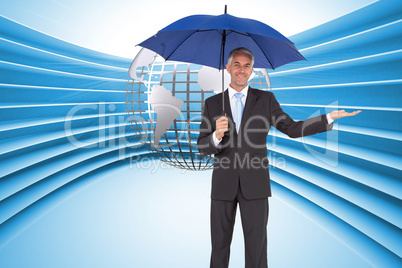 Composite image of peaceful businessman holding blue umbrella