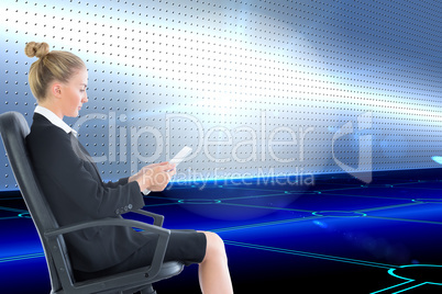 Composite image of businesswoman sitting on swivel chair with ta