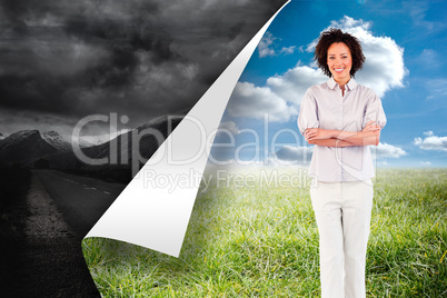 Composite image of businesswoman with crossed arms