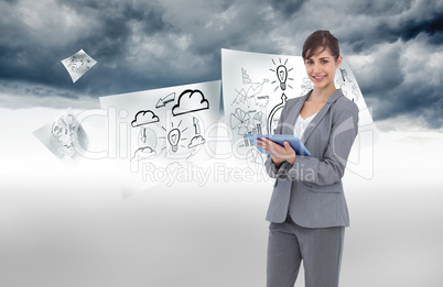 Composite image of smiling businesswoman with tablet computer