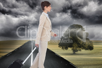 Composite image of serious businesswoman pulling suitcase