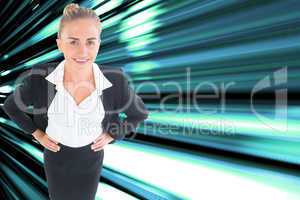 Composite image of businesswoman standing with hands on hips