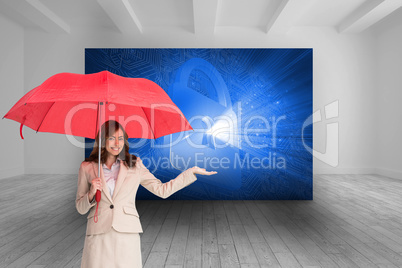 Composite image of happy businesswoman holding umbrella