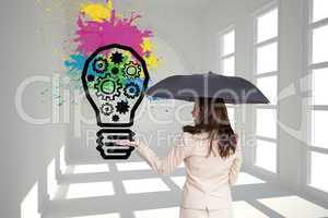 Composite image of elegant businesswoman holding black umbrella