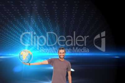 Composite image of handsome man holding out a globe