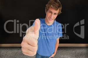 Composite image of fisheye view of a male student the thumb-up