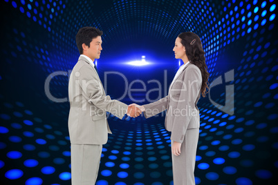 Composite image of side view of hand shaking trading partners