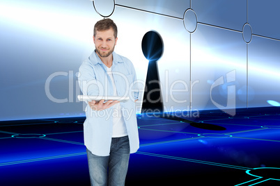 Composite image of happy man showing laptop to camera and smilin
