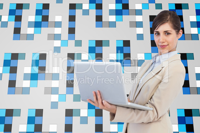 Composite image of confident young businesswoman with laptop