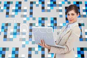 Composite image of confident young businesswoman with laptop