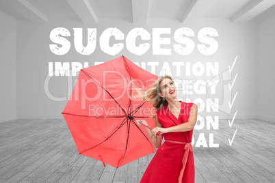 Composite image of elegant blonde holding umbrella