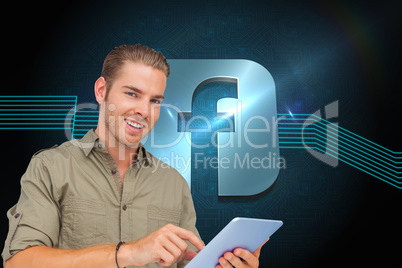 Composite image of happy man using tablet pc