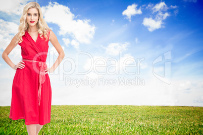 Composite image of elegant blonde standing hands on hips