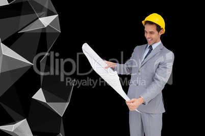 Composite image of smiling architect with hard hat looking at pl