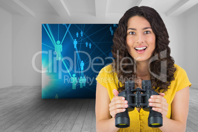 Composite image of smiling casual young woman holding binoculars