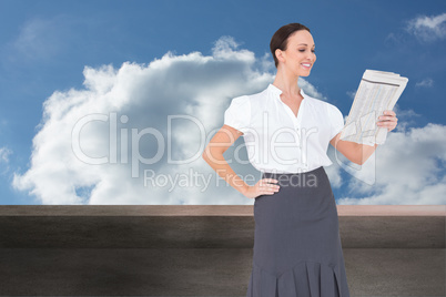 Composite image of cheerful stylish businesswoman holding newspa