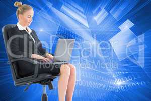 Composite image of businesswoman sitting on swivel chair with la