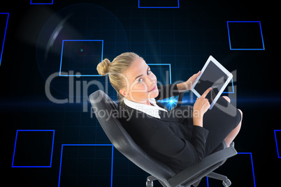 Composite image of businesswoman sitting on swivel chair with ta