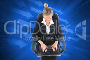 Composite image of businesswoman sitting on swivel chair with la